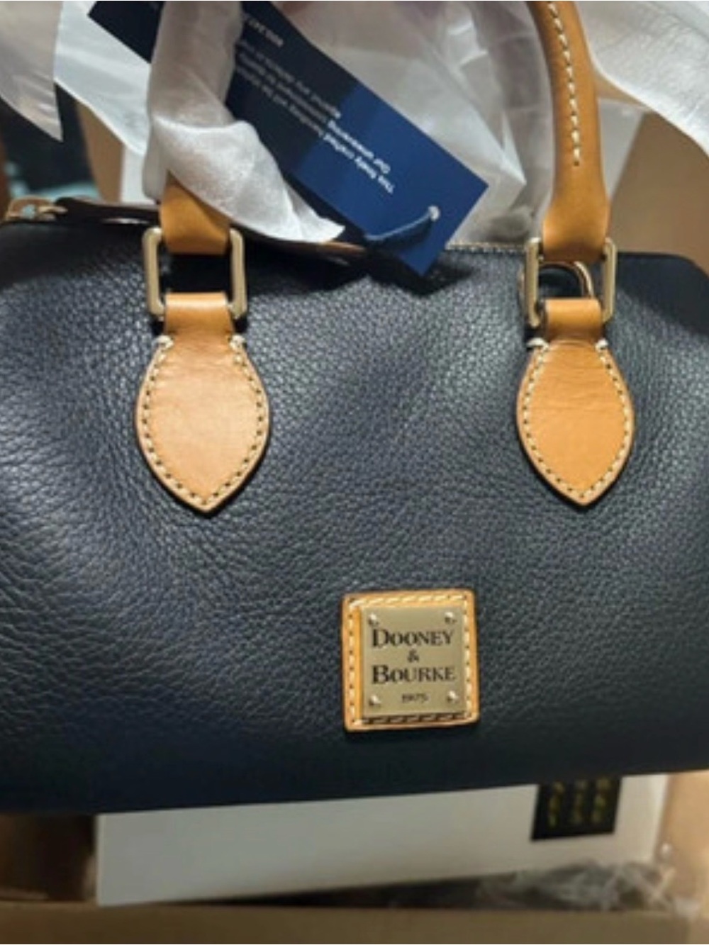 Dooney & Bourke Black Satchel with Tan Trim and Gold Plaque